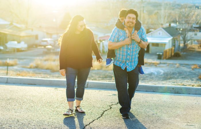 Hispanic family walks outside in Grand Junction